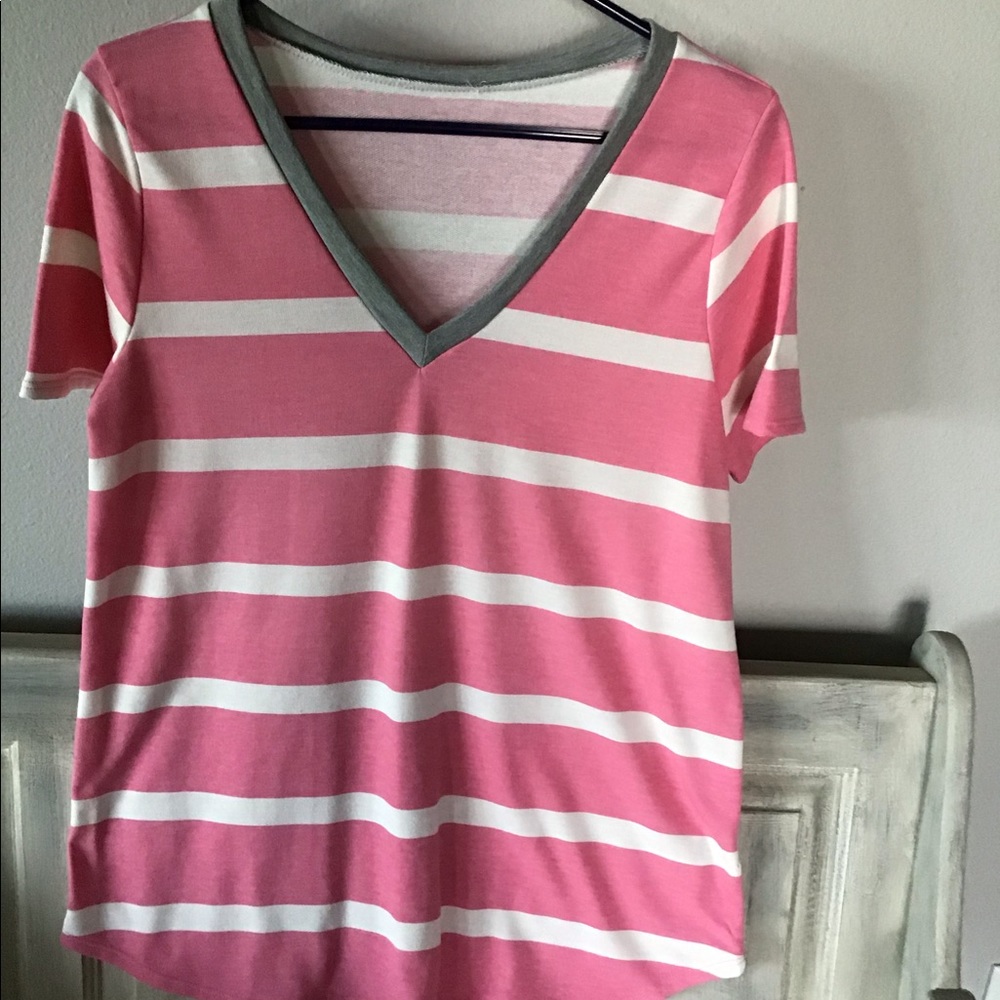 Pink and white striped V neck top.